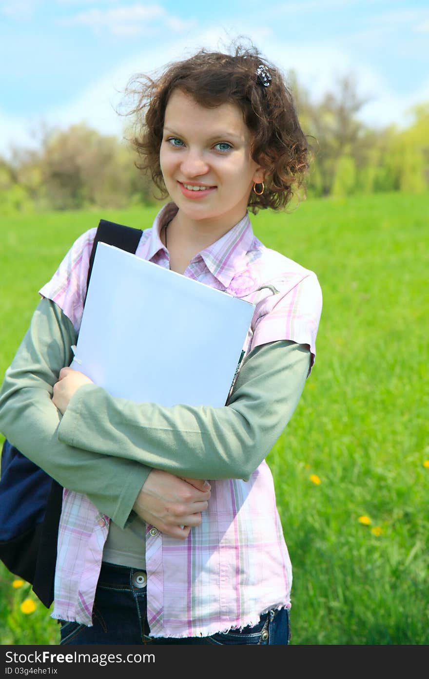 Female Teenage Student In summer Park