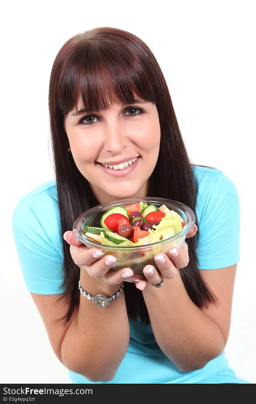 Woman holding a bowl with salad