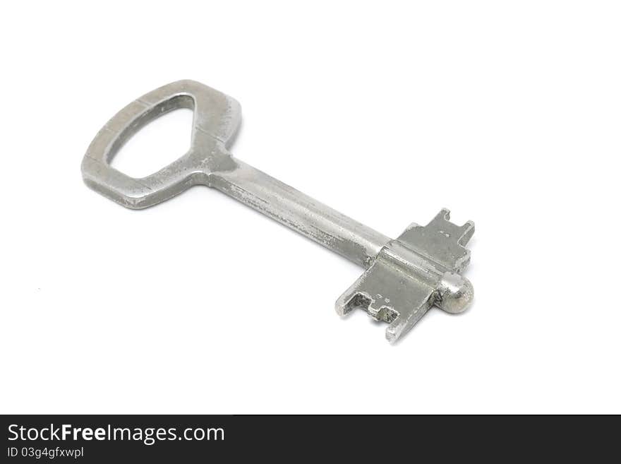 A vintage key isolated on a white background. A vintage key isolated on a white background