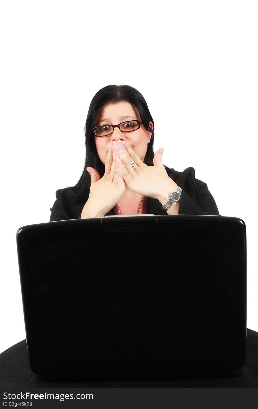 Woman gasping in disbelief at her laptop screen. Woman gasping in disbelief at her laptop screen