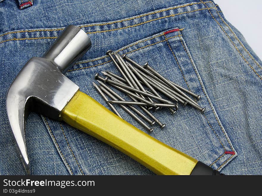 Hammer and nails on jeans