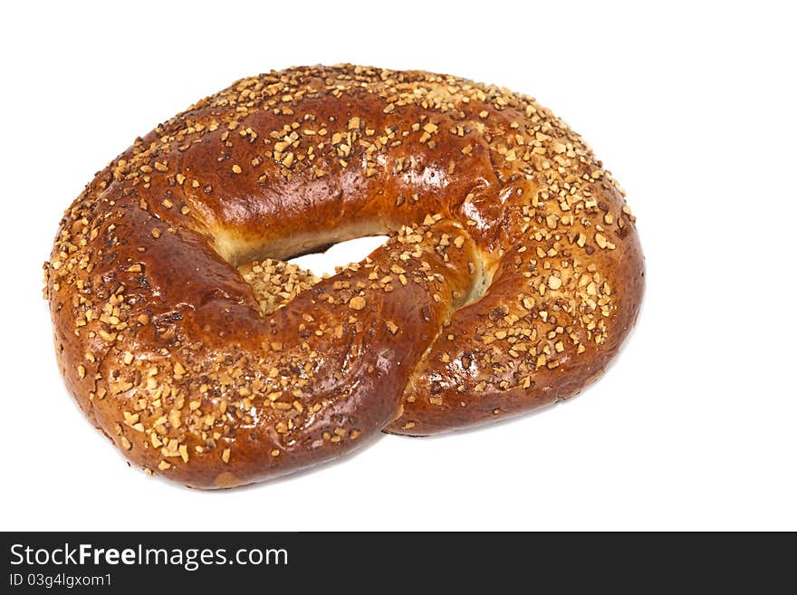 Pretzel with crushed nuts.