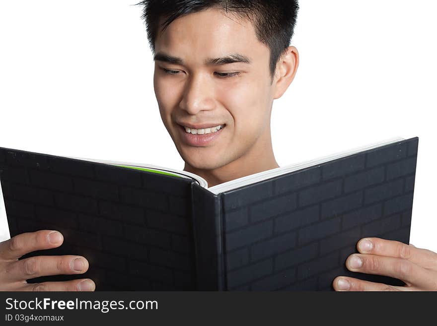 A man looking at a book on a white background. A man looking at a book on a white background