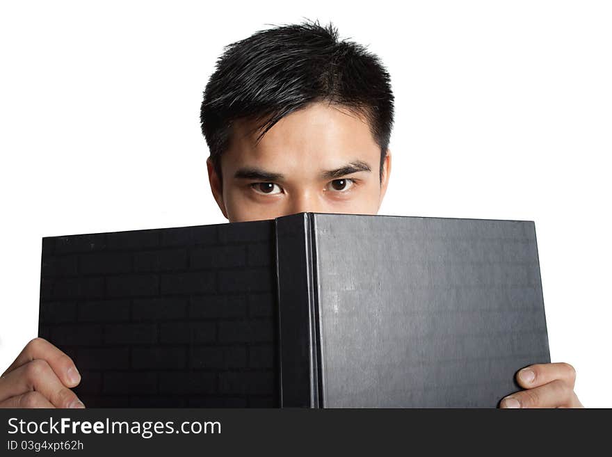 A man looking at a book on a white background. A man looking at a book on a white background