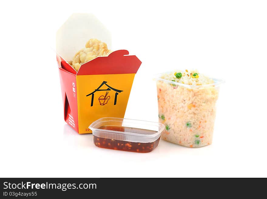 Grilled meat and rice with vegetables in disposable containers. Chinese cuisine