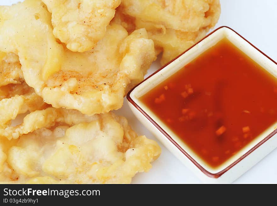 Deep fried chicken with red sauce. chinese cuisine