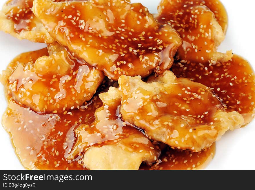 Deep fried chicken with red sauce. chinese cuisine