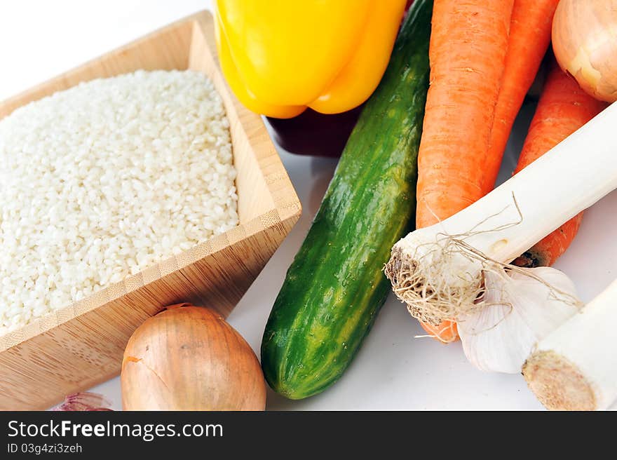 White rice and variety of vegetables for cooking traditional Chinese cuisine. White rice and variety of vegetables for cooking traditional Chinese cuisine