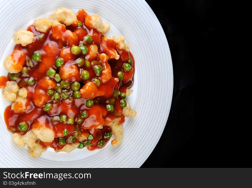 Deep fried chicken with red sauce. chinese cuisine