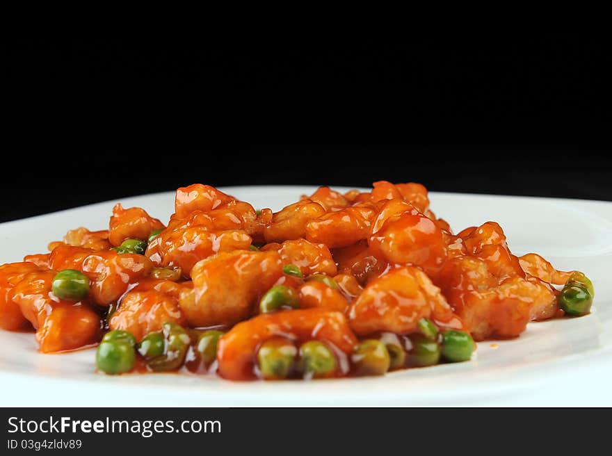 Deep fried chicken with red sauce. chinese cuisine