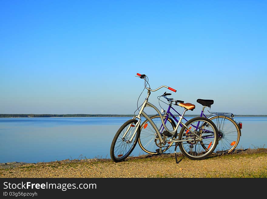 Bicycles parking on the lake before sunset. Bicycles parking on the lake before sunset