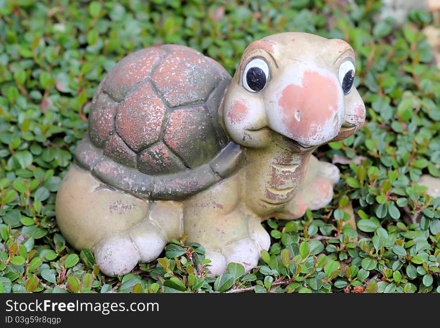 Decorative turtle figurine in garden