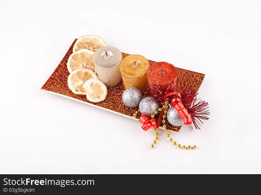 Pumpkin placed on the rectangle plate with candle, lemon and mix of nuts on the plate. Pumpkin placed on the rectangle plate with candle, lemon and mix of nuts on the plate.