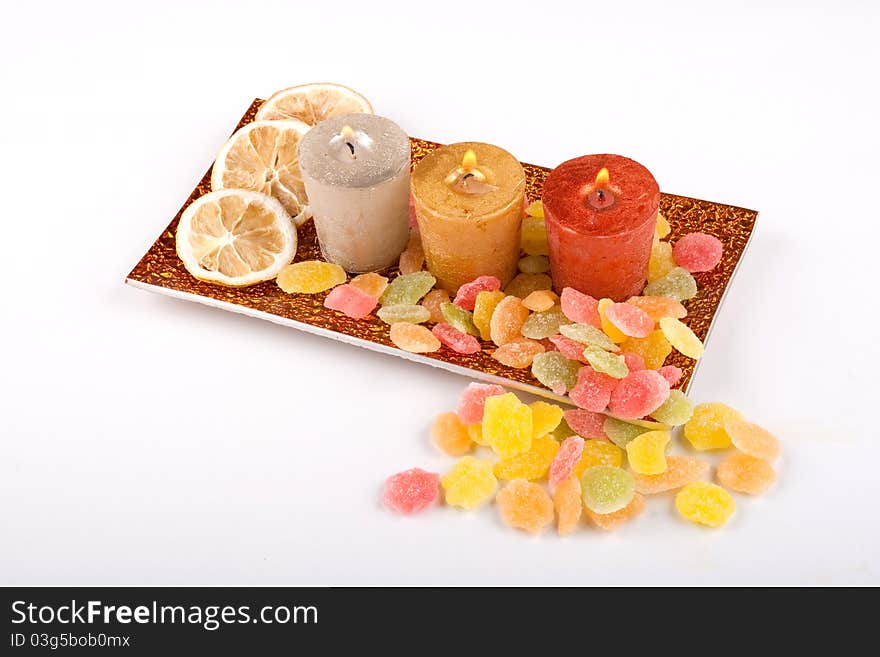 Candles with lemon and candy