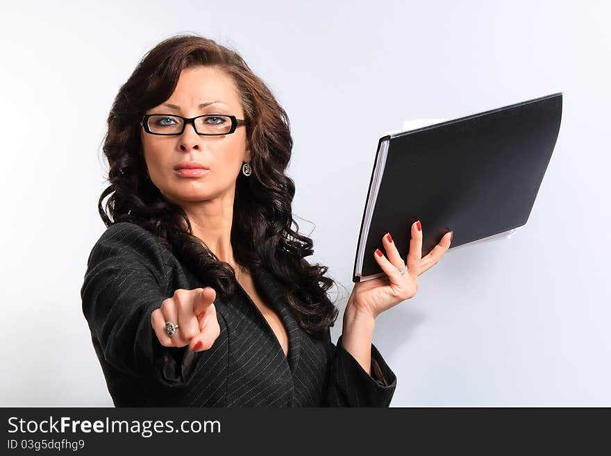 Portrait of confident business woman in the background documents