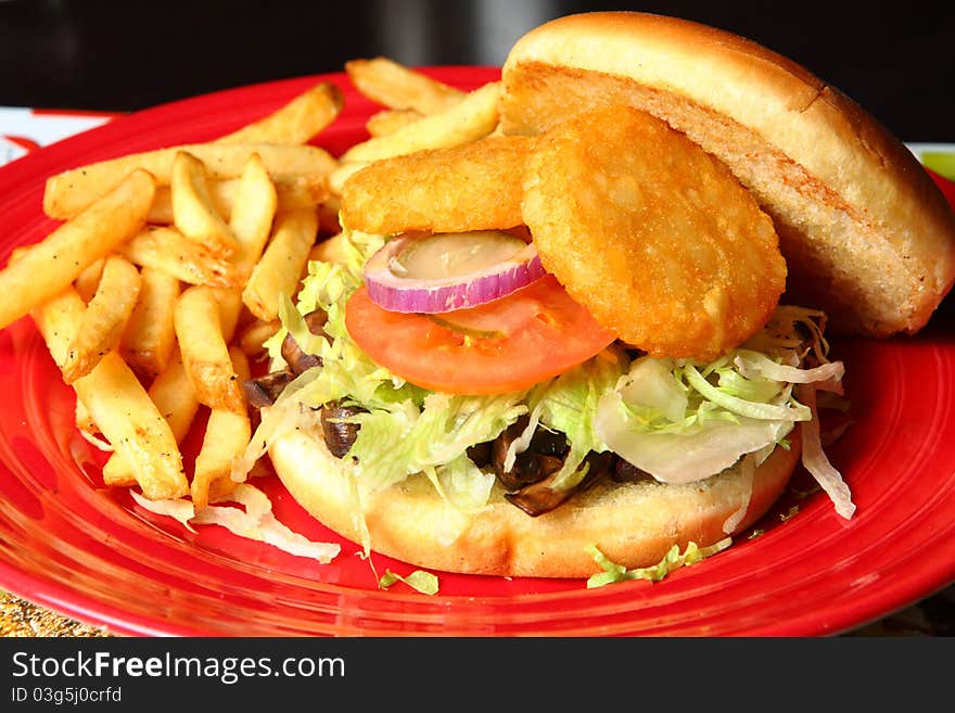 Sandwiches With Fried Potato On A Red Plate