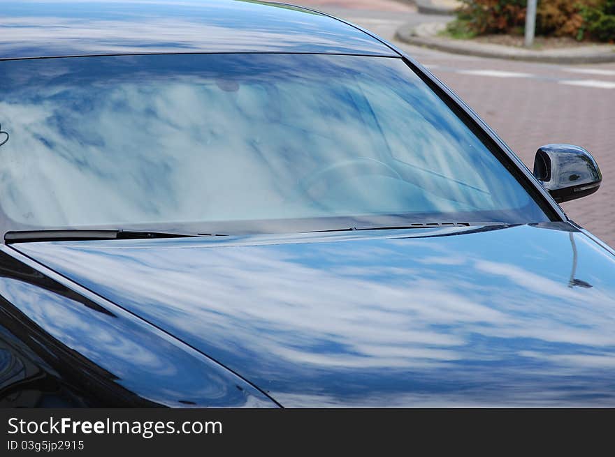 A black solid looking car. A black solid looking car