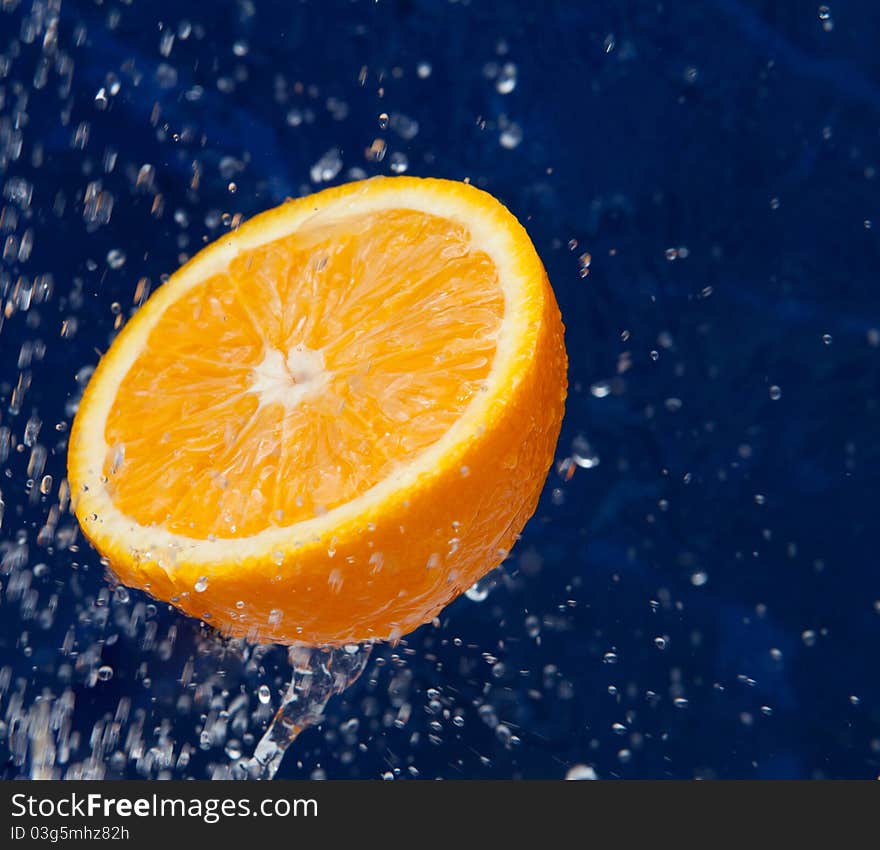 Fresh sweet orange under drops of water. Fresh sweet orange under drops of water