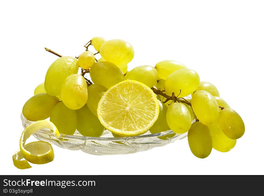 Grapes And Lemon  On The White Isolated Background