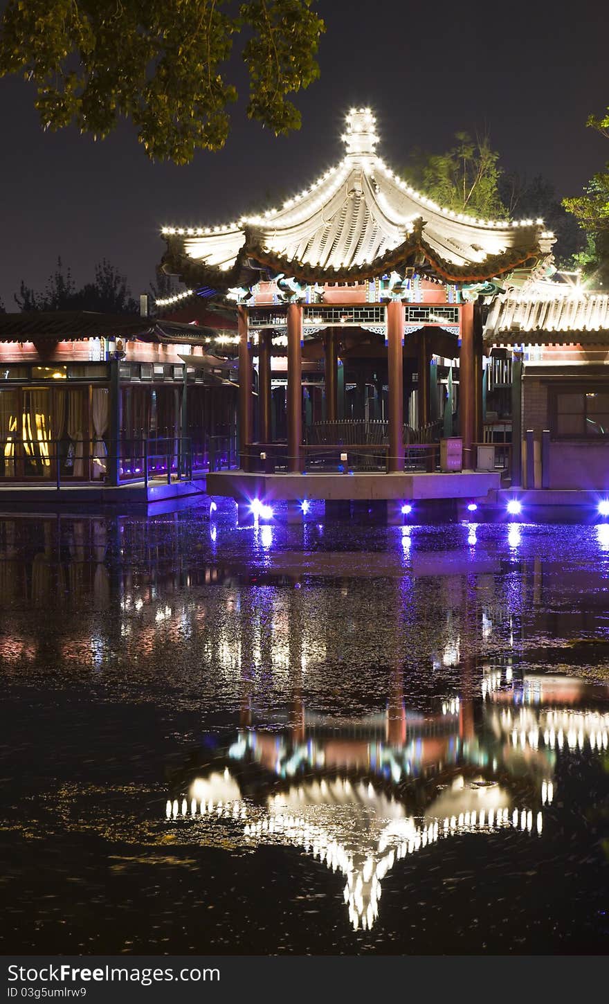 Night scene of pavilion reflection in lake, Beijing Houhai, China