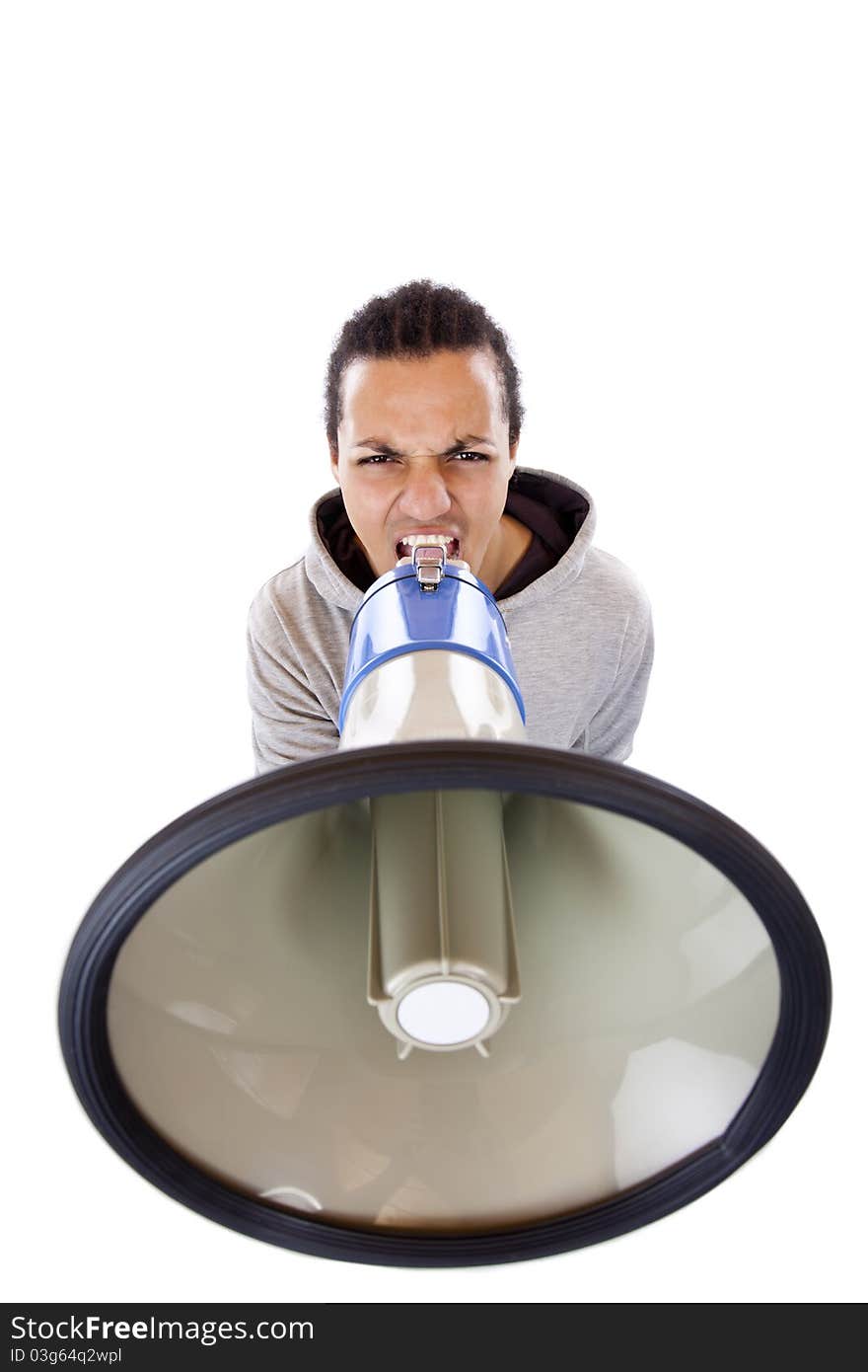 Dark-skinned young African shouts angrily in megaphone.Isolated on white background. Dark-skinned young African shouts angrily in megaphone.Isolated on white background.