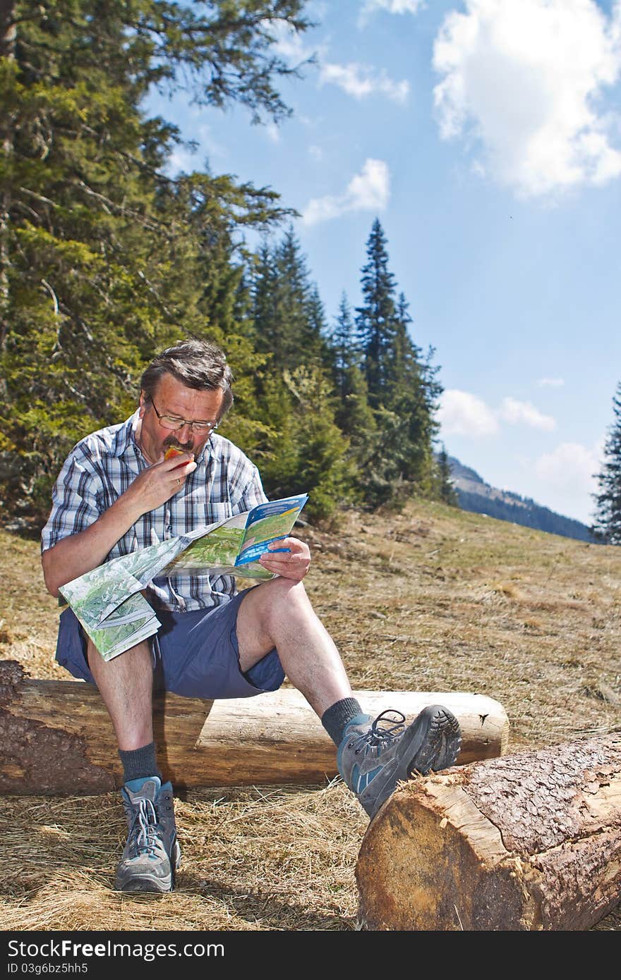 Retired man hiking in the alps