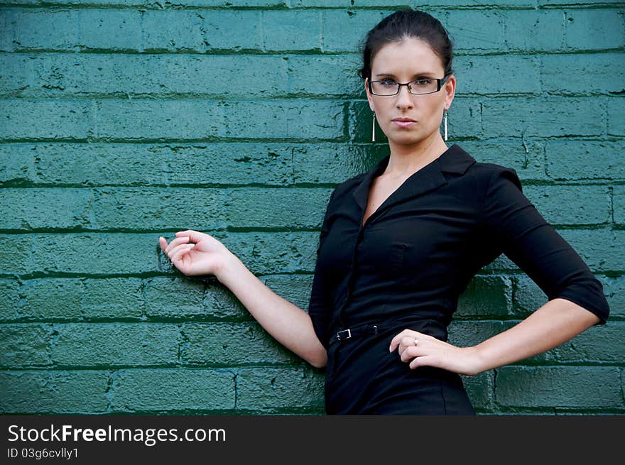 Young, empowered business woman with urban background. Young, empowered business woman with urban background.