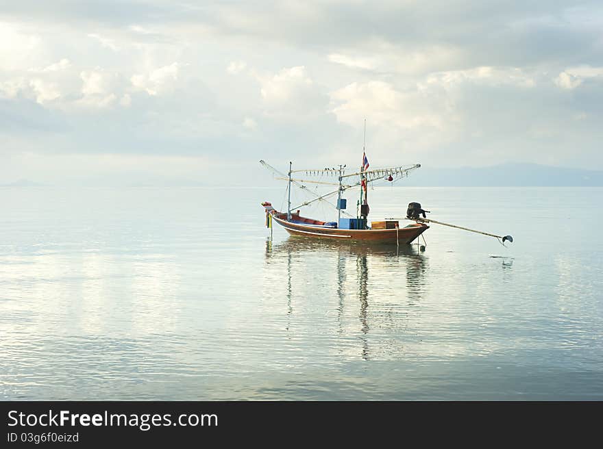 Traditional thailand boat  in the sea at sunrise