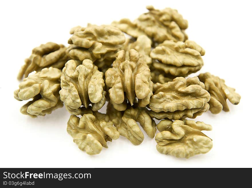 Many walnut kernels on the white background