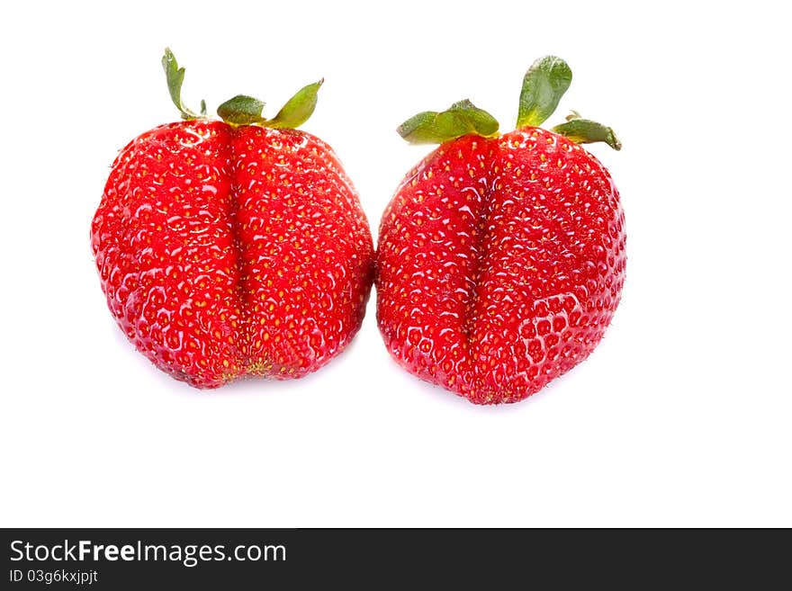 Two fresh red strawberries on a white background