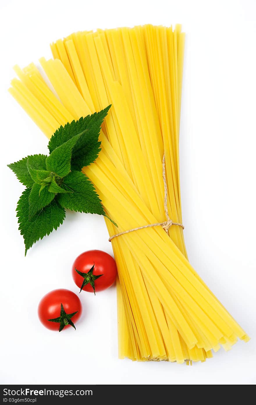 An image of two red tomatoes and pasta. An image of two red tomatoes and pasta