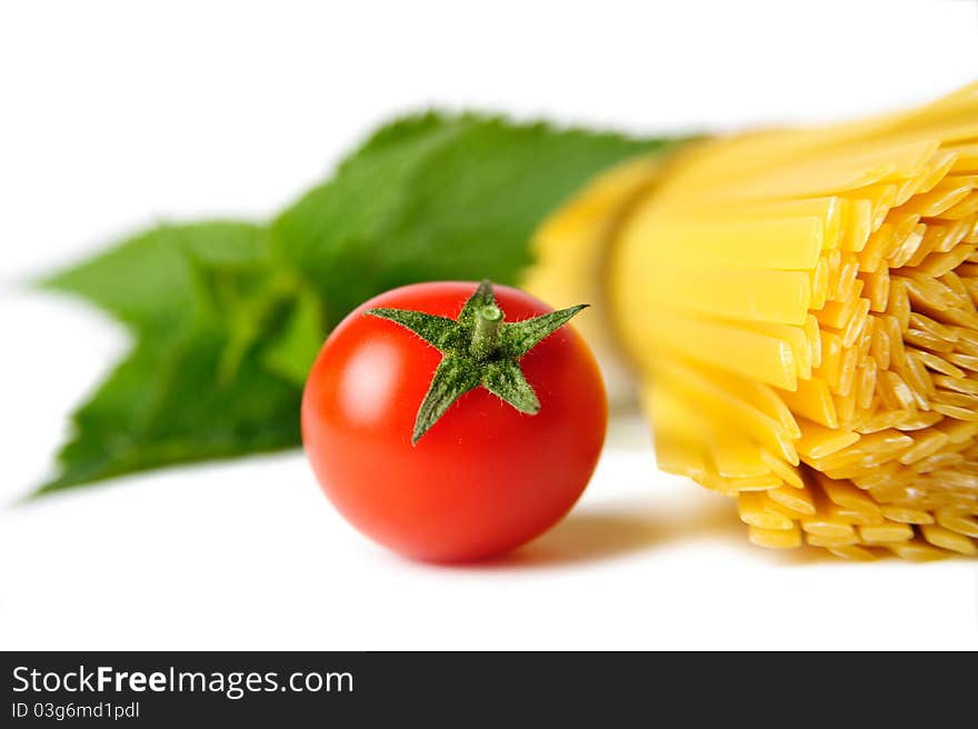 An image of a red tomato and pasta