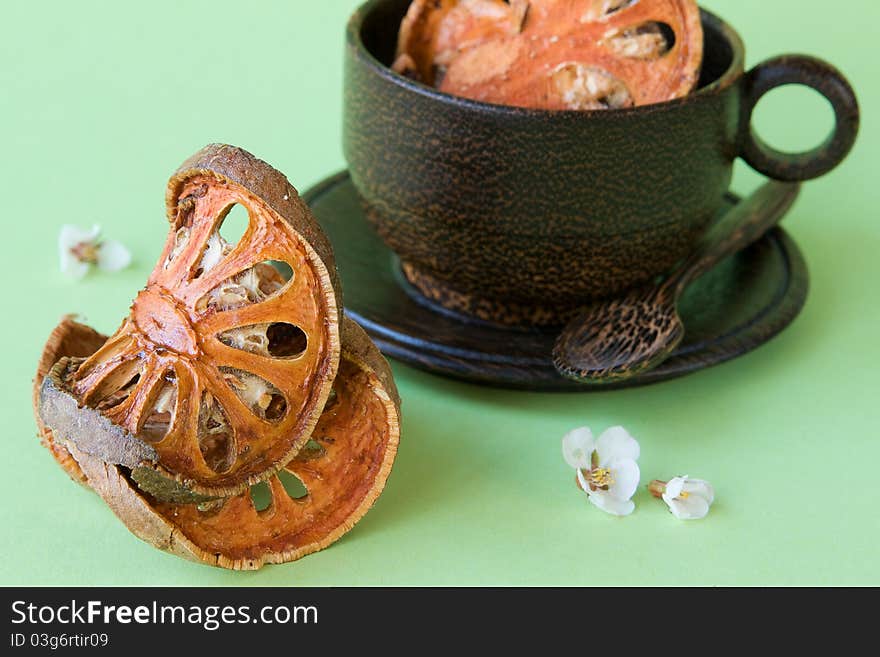 Bael Fruit tea and a cup from a coconut tree