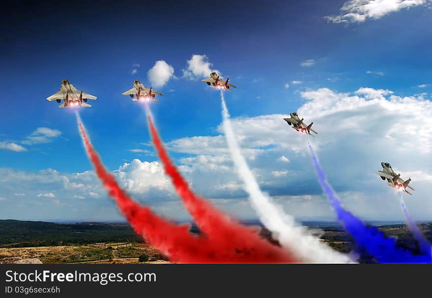 Five F15 fighters in exhibition, with blue and red colored smoke. Five F15 fighters in exhibition, with blue and red colored smoke.