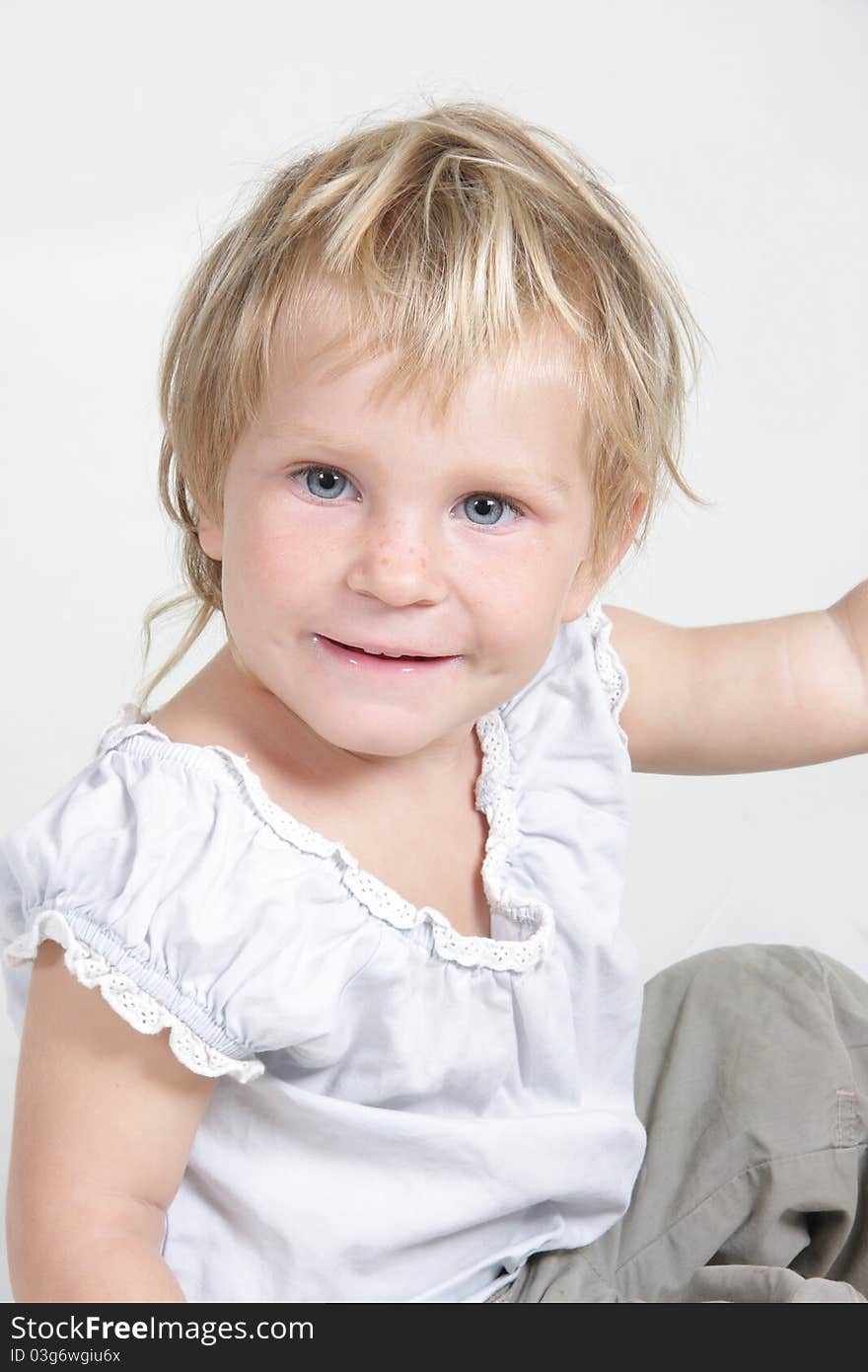 Cute toddler girl over white