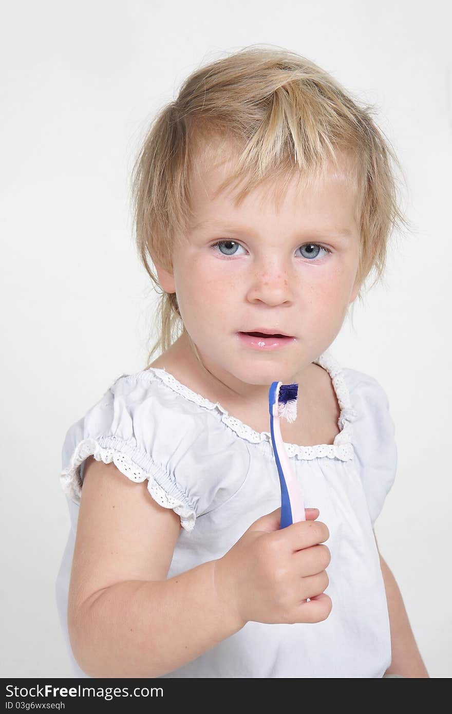 Child With Toothbrush Over White