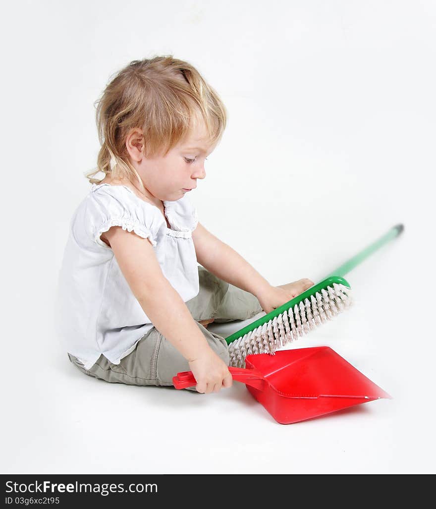 Child With Dustpan And Brush