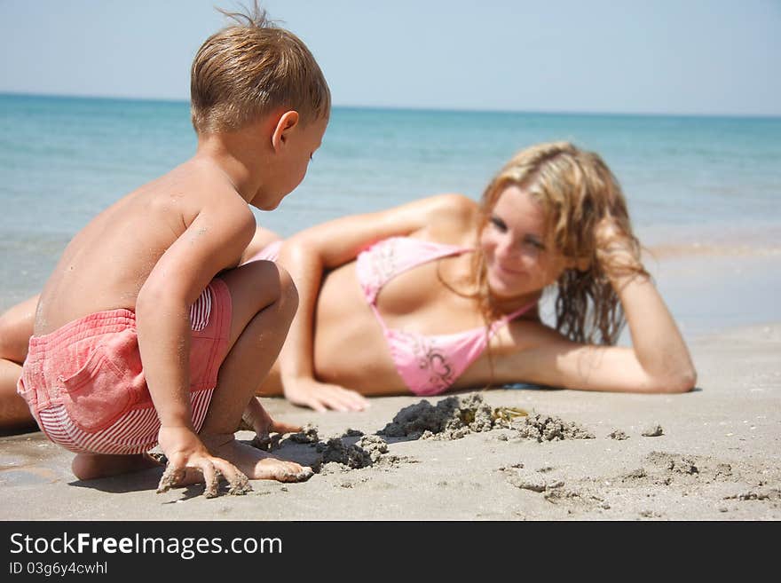 Mother And Son On Beach