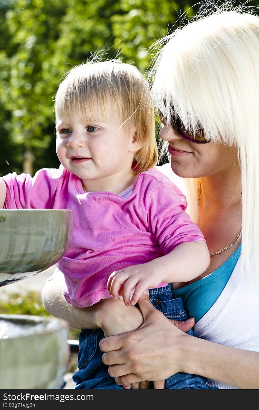 Young mothers in the park playing with children