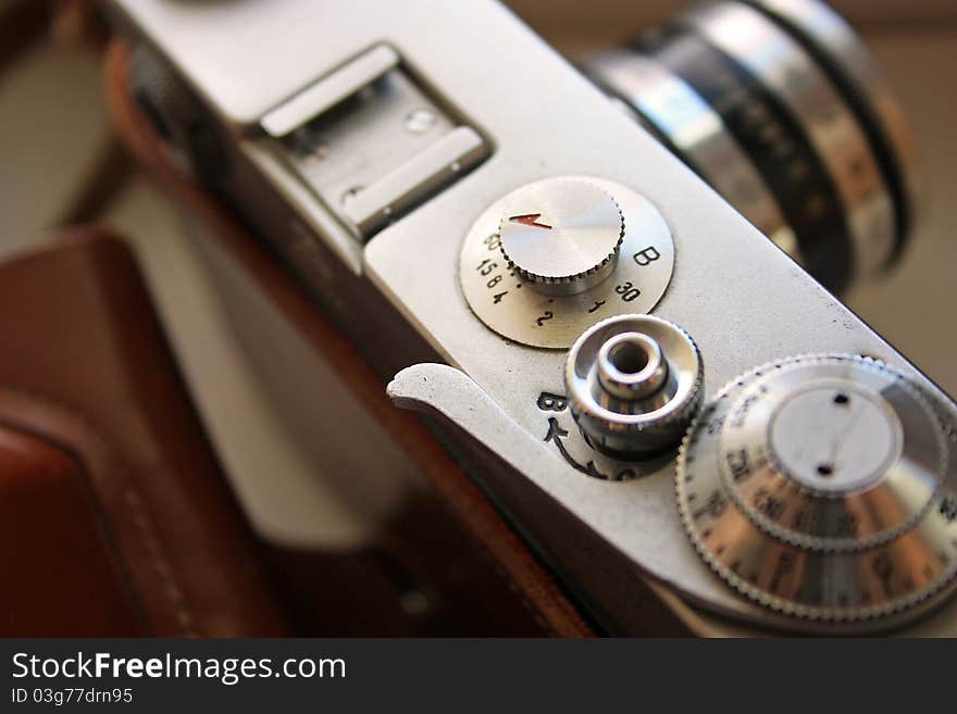 The ancient film camera from metal close up. The ancient film camera from metal close up