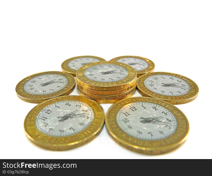 Coins in the form of hours on a white background. Coins in the form of hours on a white background