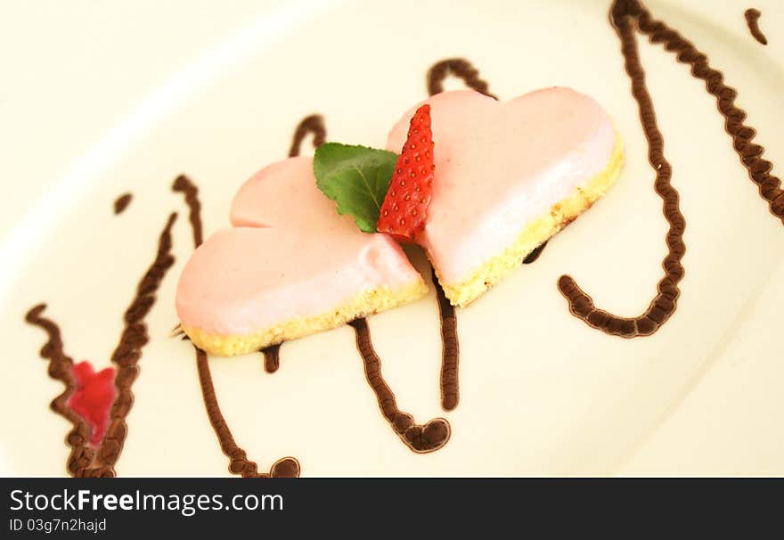 Strawberry cake on yellow plate. hearts. Strawberry cake on yellow plate. hearts