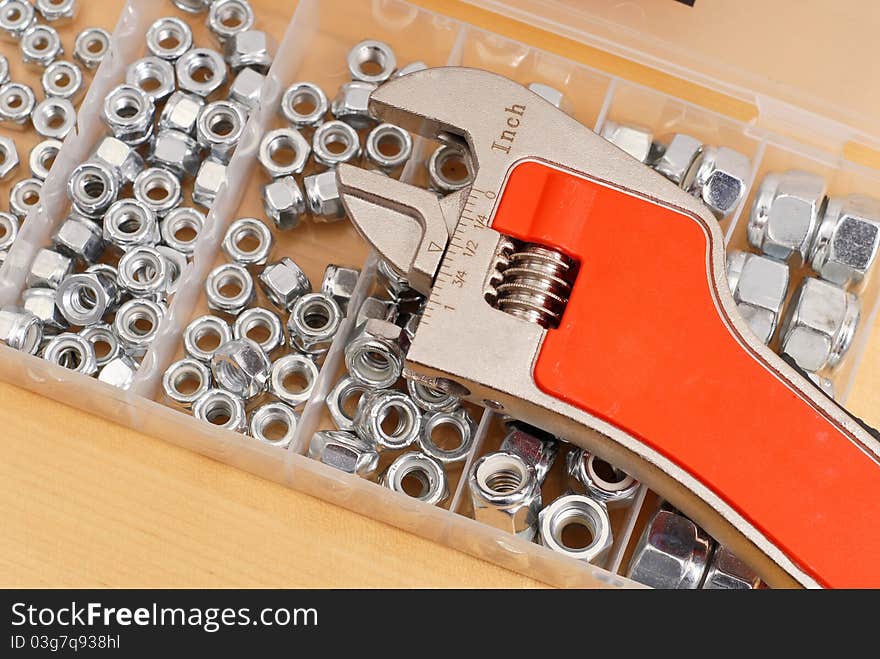 Professional Steel Wrench on Box of Screws