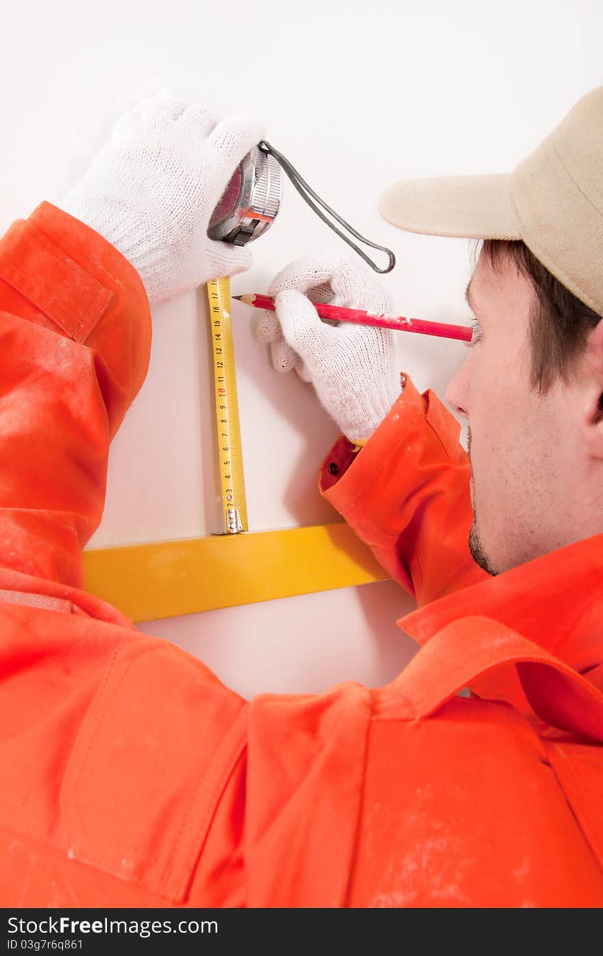 Construction Worker Doing Measuring