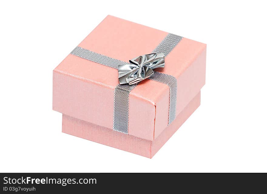 Small pink present box with silver ribbon