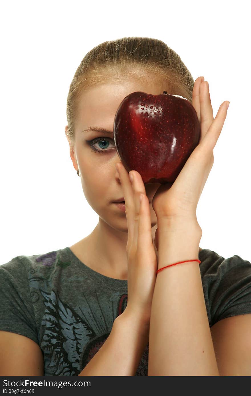 The blonde with an apple on a white background