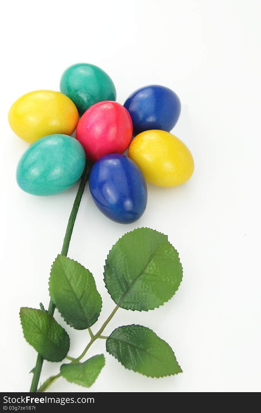 Colored Easter eggs arranged in the shape of a flower