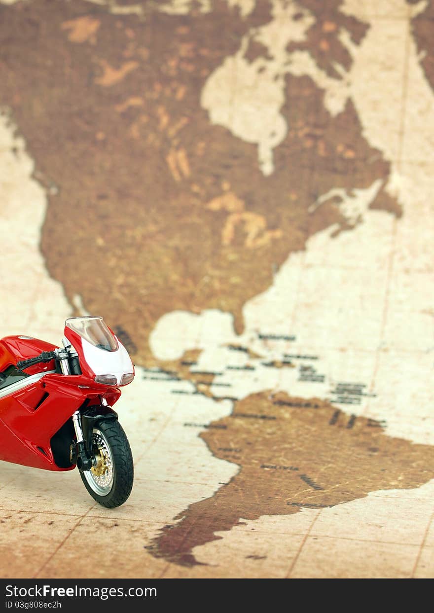 Motorcycle over world map