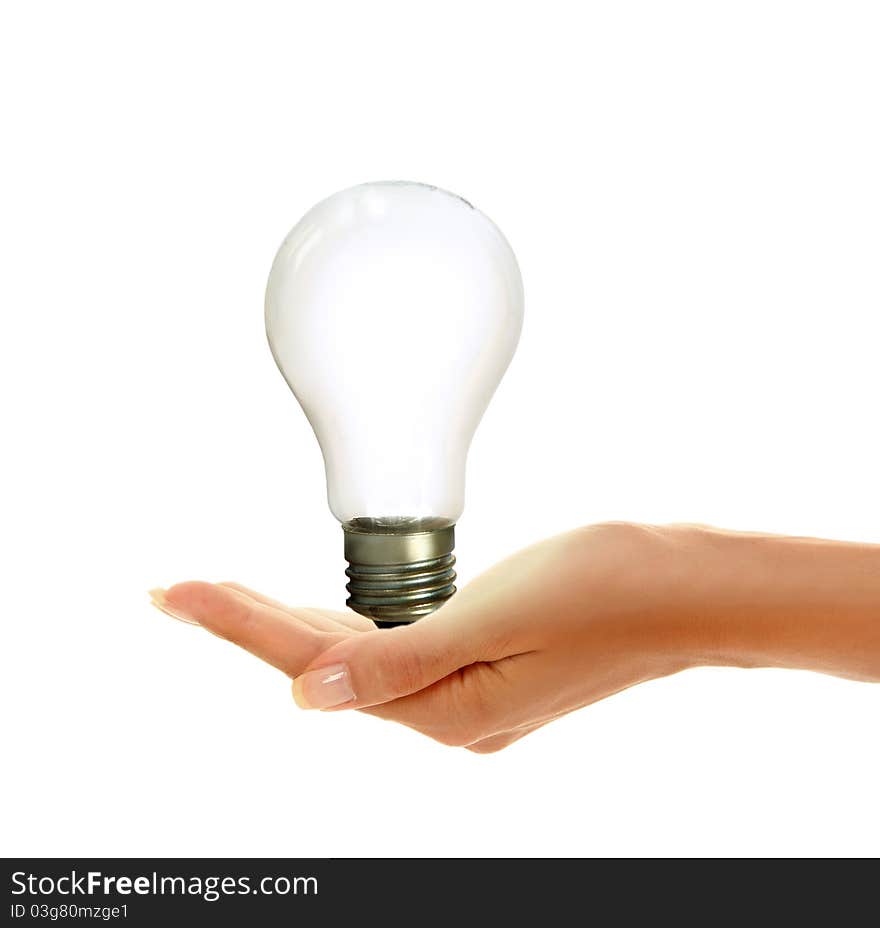 Woman's hands holding shiny lamp. Woman's hands holding shiny lamp