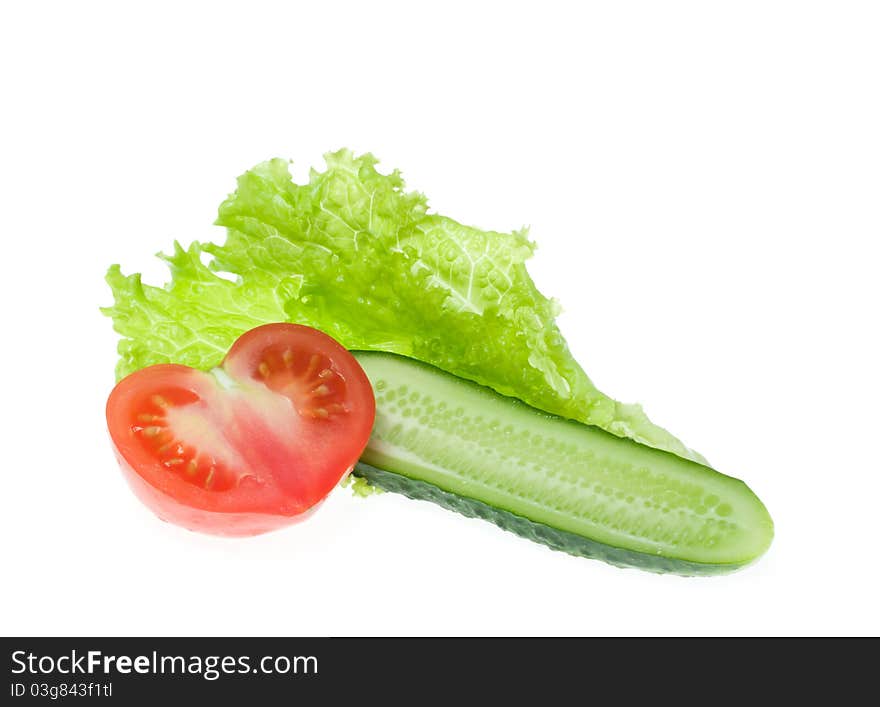 Tomato, cucumber and lettuce on a white background. Tomato, cucumber and lettuce on a white background